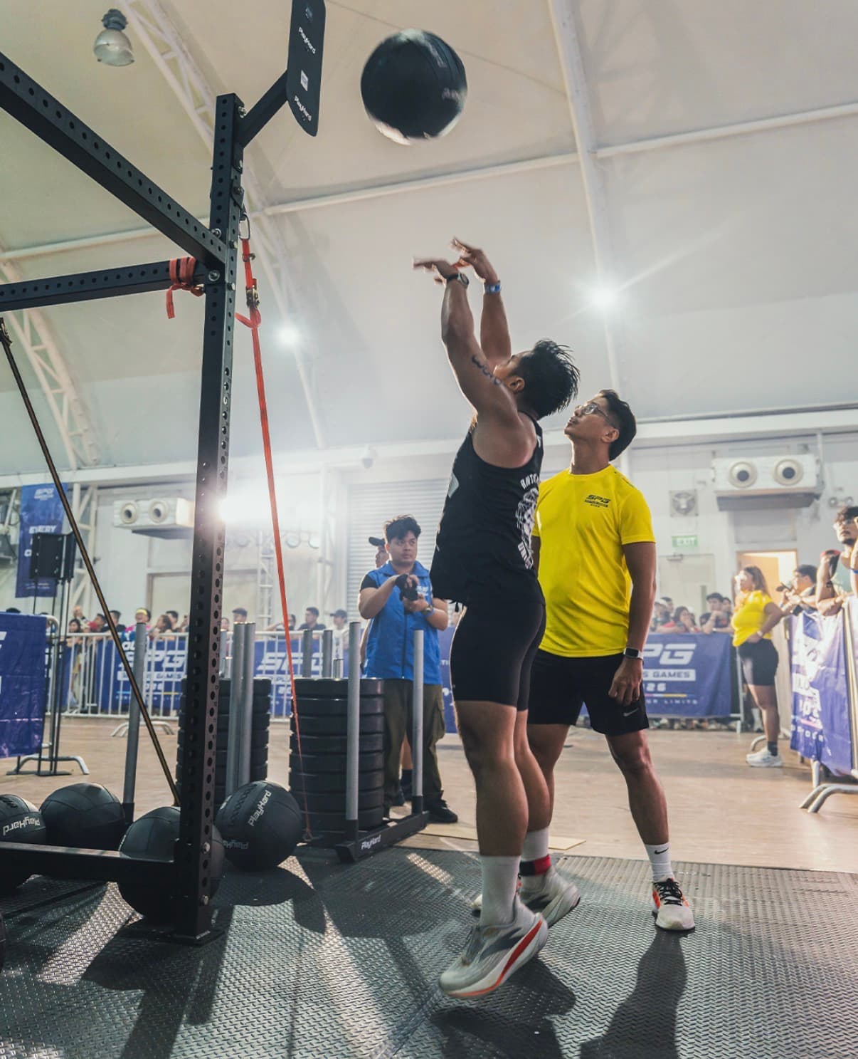 Wall balls at a hybrid fitness race